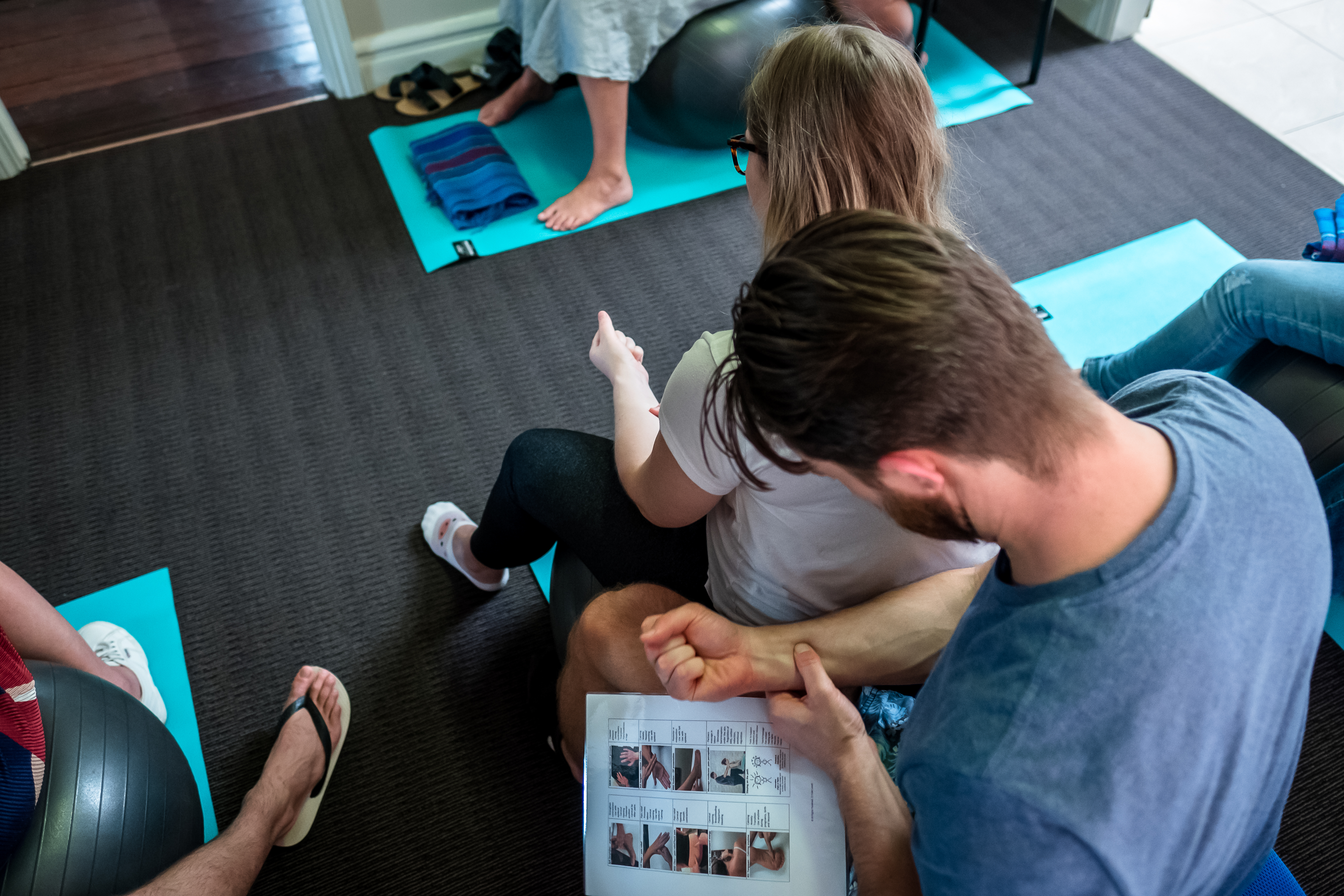 Birth partner learning practical labour support techniques during a workshop in Perth.